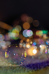 Abstract blurred magic background. Bubbles with LED backlight and bokeh on the blanket.
