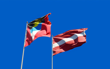 Flags of Latvia and Antigua and Barbuda.
