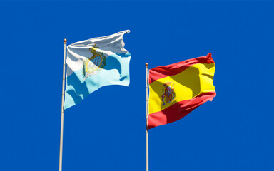 Flags of San Marino and Spain.