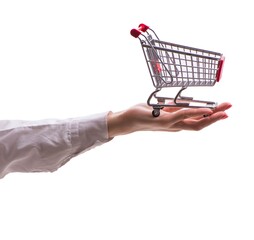 Hand holding shopping cart isolated on white