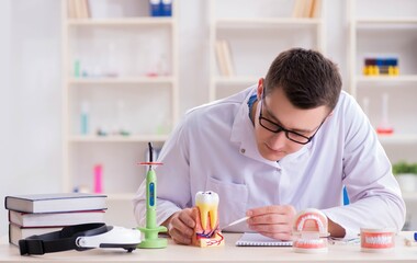 Dentist working teeth implant in medical lab