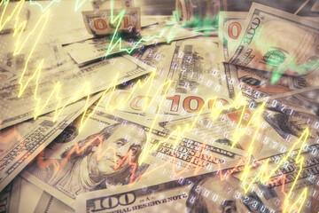 Multi exposure of forex chart drawing over us dollars bill background. Concept of financial success markets.