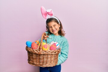 Girl Wearing Easter Bunny Ears Holding Basket