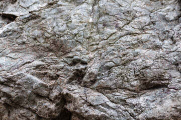 Closeup texture of a grey granite wall