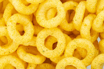 Beer snacks. Background of corn rings of sticks with cheese and green onion flavor.