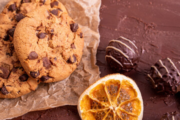 dark chocolate chip cookie round gold concept Organic fresh bake homemade tasty sweet dessert piece of closeup on cookie on wooden table for holiday new year Christmas gift sugar sparkle