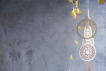 Wooden homemade boho style decorations on blurred background, minimalistic scandinavian decor, selective focus