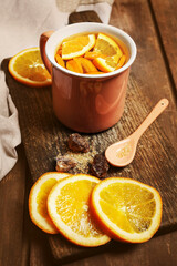 Hot tea with fresh oranges.
