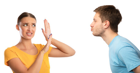 Man trying to kiss confused woman rejecting him