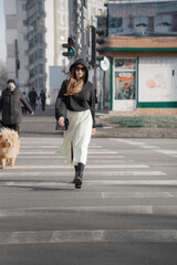 Woman crossing street on crosswalk