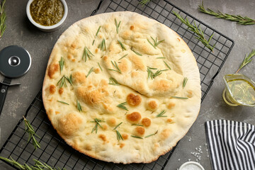 Flat lay composition with focaccia bread on grey table