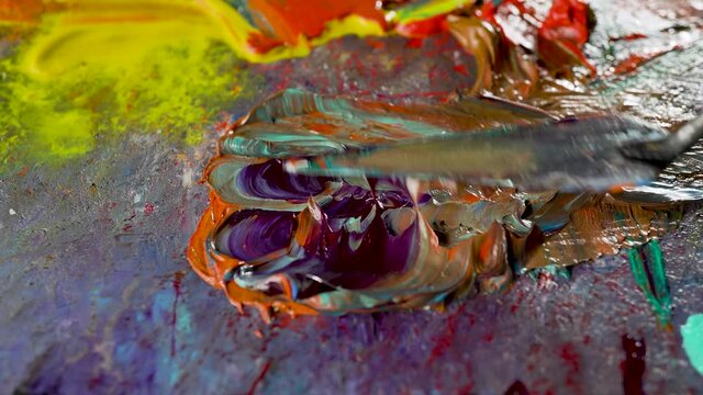 Multi-colored oil paints on an artistic palette.