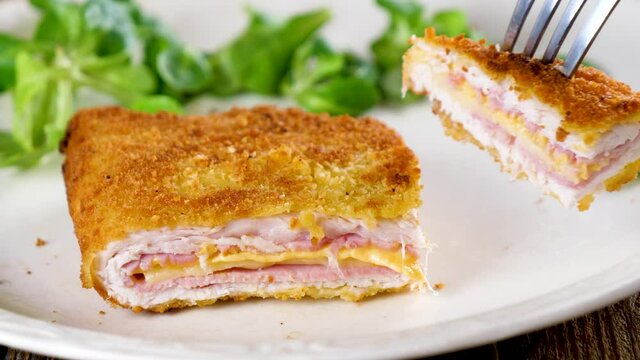 eating cordon bleu food and lettuce 