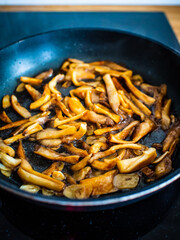 Oyster mushrooms in frying pan
