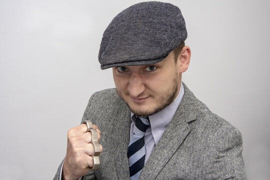 Portrait Of A Man In A Boxing Stance With Brass Knuckles, Causing Serious Bodily Harm, A Threat To Life And Health.