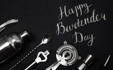 Flat lay greeting card with lettering Happy Bartender Day. Mixing, Opening and Garnishing Tools. Barmen equipment