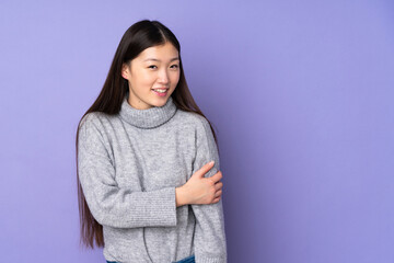 Fototapeta premium Young asian woman over isolated background laughing