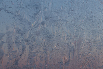 Beautiful frosty window as background, closeup. Winter morning