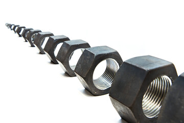 Row metal nuts on isolated white