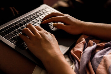 Close-up photo of typing on the keyboard, Asian woman hand typing message on laptop, Laptop typing concept.
