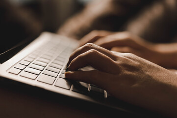 Close-up photo of typing on the keyboard, Asian woman hand typing message on laptop, Laptop typing concept.