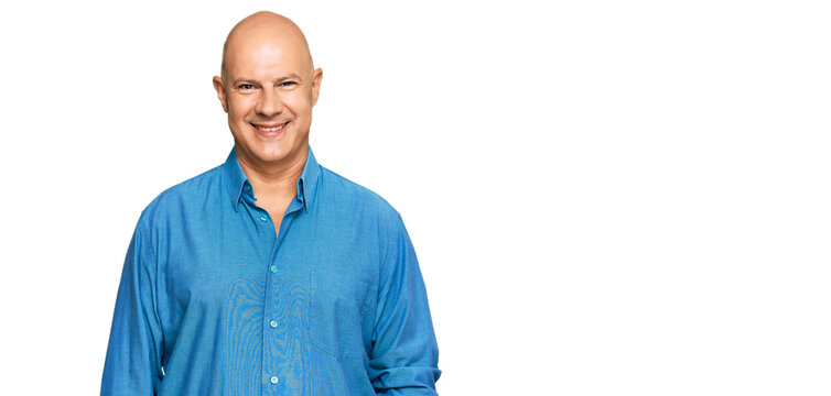 Middle age bald man wearing casual clothes with a happy and cool smile on face. lucky person.