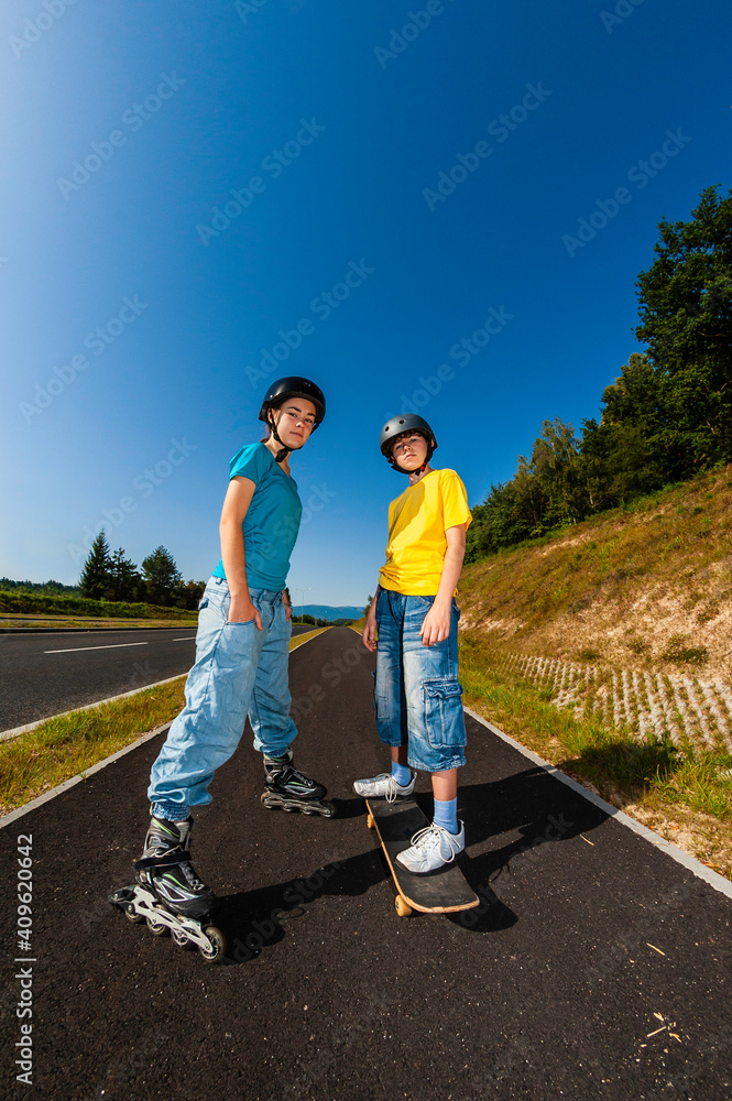 Wall mural Happy young people rollerblading, skateboarding