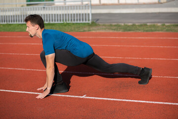 Runner guy doing stretching before jogging