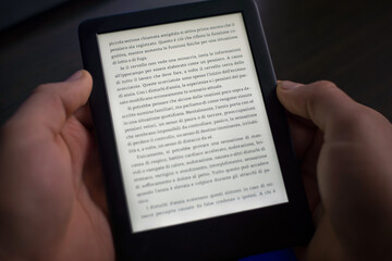 The person is reading the digital book.