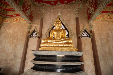 Golden buddha statue at Wat Si Sa Thong, Amazing old Historical Sites in Thailand.
