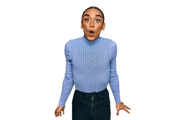 Fototapeta premium Hispanic transgender man wearing make up and long hair wearing casual clothes scared and amazed with open mouth for surprise, disbelief face