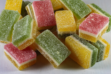 Multi colored layered marmalade. Closeup of wonderful dessert.