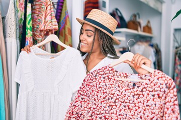 Young african american woman smiling happy at retail shop