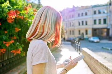 Close-up of teenager girl's head with multi-colored dyed hair, complex coloring