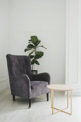 Modern armchair against white wall