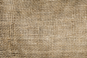 Natural brown linen fabric background. Fiber structure texture. Vintage canvas pattern. Rustic decoration pattern. Antique hessian bag textile background.