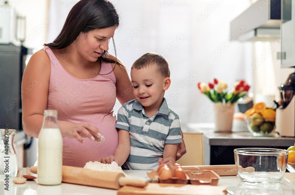 Wall mural Mother and son have fun in the kitchen