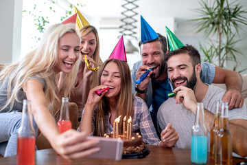 Friends take selfie at birthday party