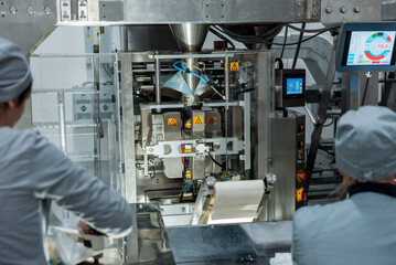Vertical multi-head weigher packaging machine snacks and chips in a factory