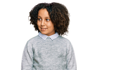 Young little girl with afro hair wearing casual clothes smiling looking to the side and staring away thinking.