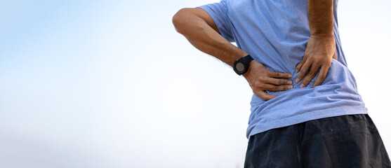 Young man back injury after exercise , Sport injury, Man with back pain