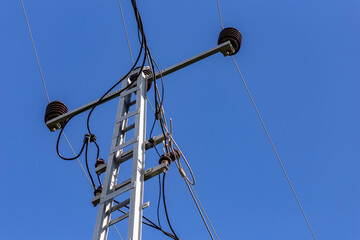 Old electricity pole and blue sky in Turkey.