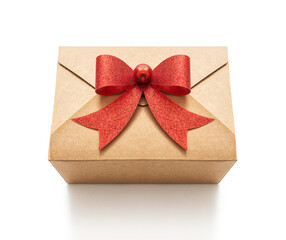 Gift cardboard box with red bow on white background, including clipping path