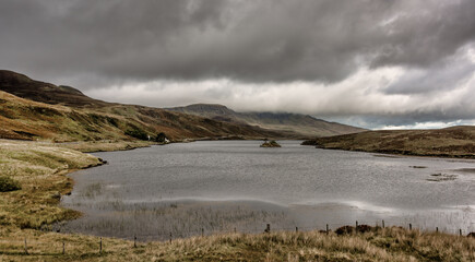 A bleak morning on the Isle of Skye in Scotland. Looking down Loch Fada towards the Old Man of Storr which is covered in low cloud. 