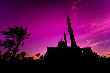 Beautiful large Islamic mosque at the sunset sky background