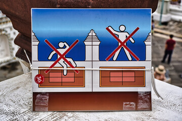 Warning signs at Temple of Dawn, Wat Arun is a buddhist temple and derives its name from the Hindu...
