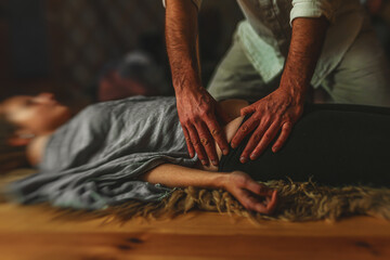Masseur doing massage on woman body. Beauty concept.