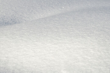 White snow texture on clear day. Winter background. Snow drifts. white snowflakes background, rough...