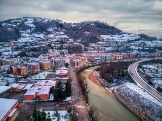 Aerial view of the town of Blimea under a snowfall.