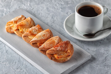 Homemade baking, homemade cookies with cottage cheese and a cup of coffee on gray background